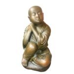 Shaolin statue clenched fist on stone