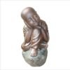Shaolin statue brooding on stone