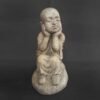 Shaolin statue sitting on Stone