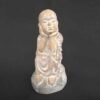 Shaolin statue sitting on Stone
