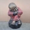 Shaolin statue sleeping on stone