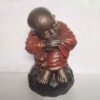 Shaolin statue sleeping on stone